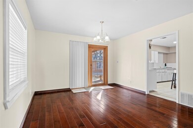 Unfurnished dining area with a chandelier, visible
