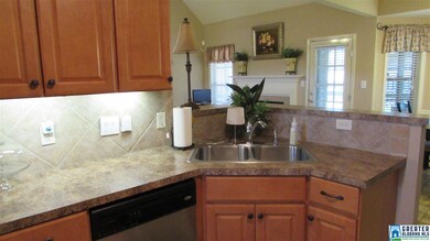 Corner sink behind the high top breakfast bar.