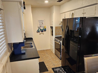 Kitchen with stainless steel range with gas cookto