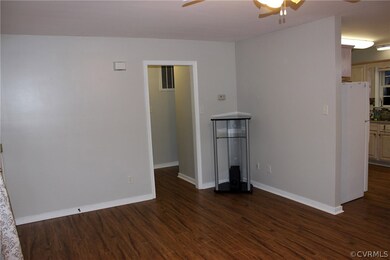 Large family room with laminate floors and a ceili