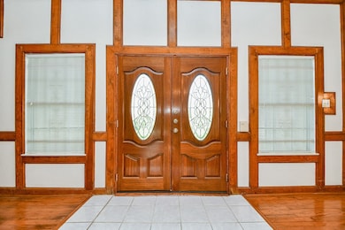 The entry with double doors and leaded glass inser