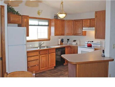 All appliances stay in this handy kitchen. Floorin