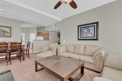 Living room with visible vents, baseboards, a ceil