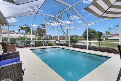 Swimming pool featuring a patio, glass enclosure,