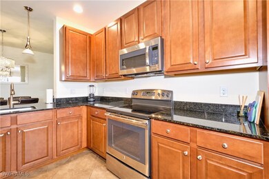 Kitchen featuring light tile patterned flooring, a