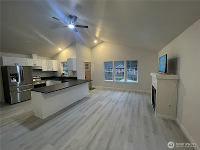 Enjoy the open concept kitchen, propane fireplace, leather finish granite countertops and soft close cabinetry.