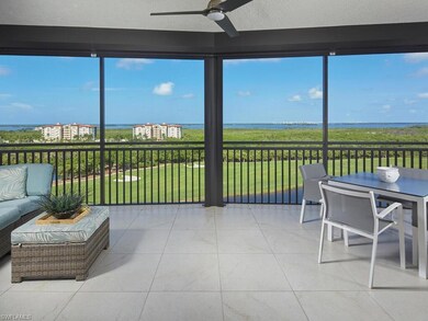 Sunroom with a water view and ceiling fan