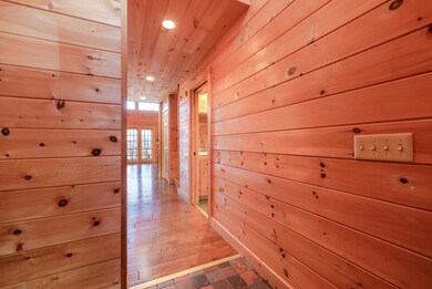 INT. FRONT ENTRACE TOWARDS HALLWAY