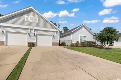 View of front of property featuring a garage and a