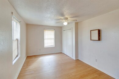 This bedroom features custom paint, ceiling fan wi