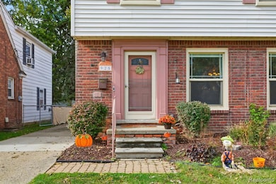 Property entrance featuring brick siding