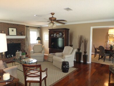 Beautiful Living Area With Wood Floors In Main Are