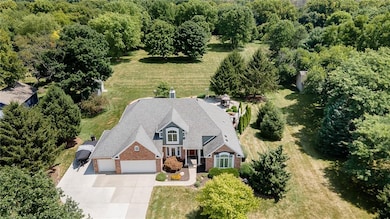 Over 2 acres of manicured lawn with beautiful trees