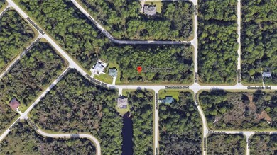 Aerial view with houses on street.