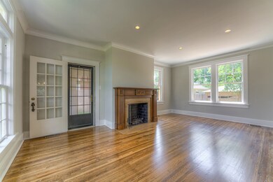 As you step into the grand foyer you see the large, open, airy, and impressive formal living room. Off of this room is the screened in porch