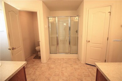 Master Bathroom with double sinks and water closet