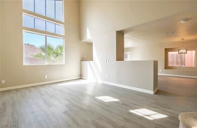 Spacious living room with vaulted ceiling.