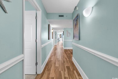 Hallway with light hardwood / wood-style floors