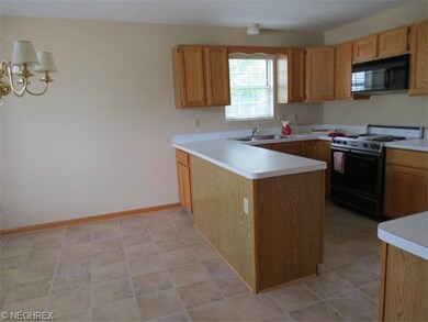 A view of the kitchen from the entry way door.  Th