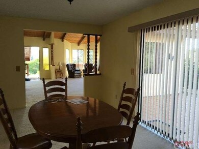 Patio visible through window coverings to open pat
