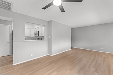 Unfurnished living room with light wood finished 