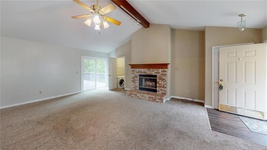 Wooden beam, gas fireplace, coat closet, and main 