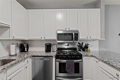 Kitchen with appliances with stainless steel finis