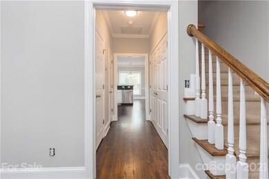 Airy entry with new light fixtures throughout