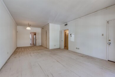Unfurnished room with crown molding and light colo