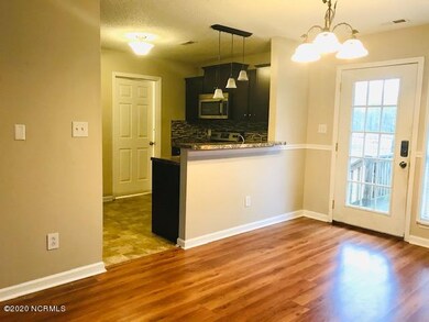 Dining and Kitchen, view of Laundry door