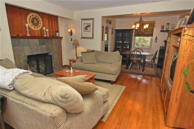 Cozy, open living room with working fireplace!