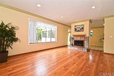Living Room with cozy fireplace separating the Liv