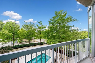 The large balcony overlooks the pool and hot tub.