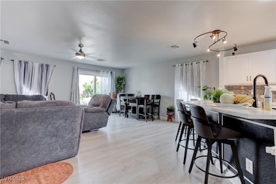 Living room featuring light wood-style floors and