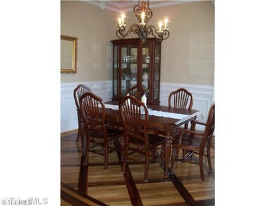 Dining Room. Dinning room has inlay wood floors.
