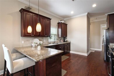 Wide kitchen with breakfast bar.