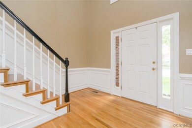 Gracious entry with sidelights and arch window , w