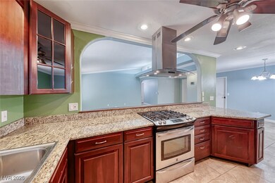 Kitchen with stainless steel gas stove, island exh
