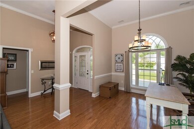 Foyer and formal dining room view. Hardwood floori