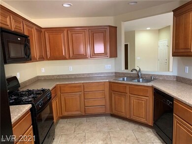 Kitchen featuring black appliances, recessed light