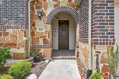 Home features a stone and brick facade exterior