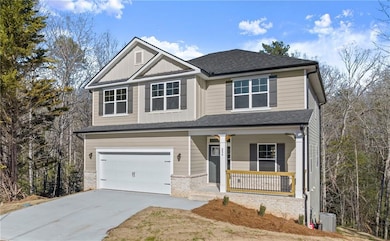 Craftsman-style home featuring a porch, an attache