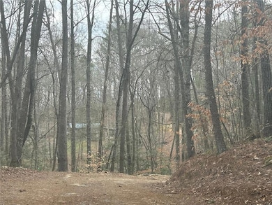 View of landscape featuring a view of trees