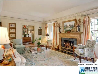 Beautiful carved pine mantel with marble surround.