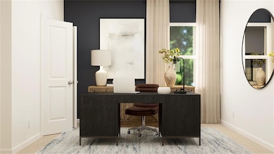 Office space featuring baseboards and light colored carpet