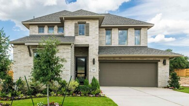 View of front of property with a garage, roof wit
