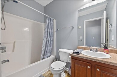 Full bathroom with shower / bath combo, vanity, an
