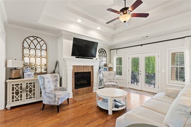 The living room is bright and open. A gas fireplac