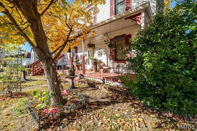 View of yard featuring covered porch