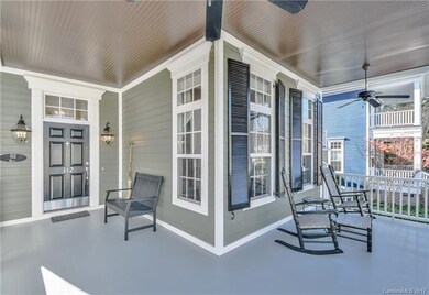 Beautiful rocking-chair front porch with ceiling f